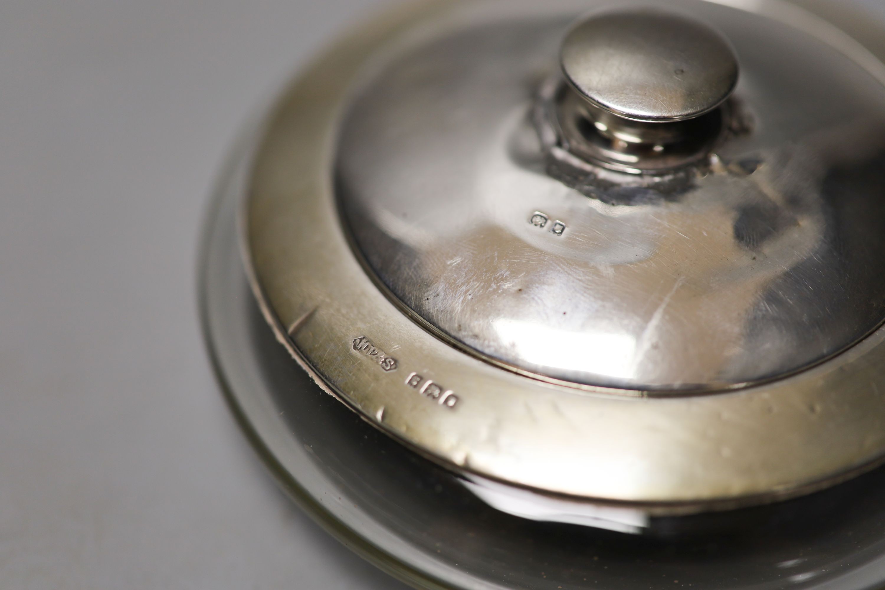 Six assorted silver mounted glass toilet jars, including a powder bowl and a Chinese white metal tot(a.f.).